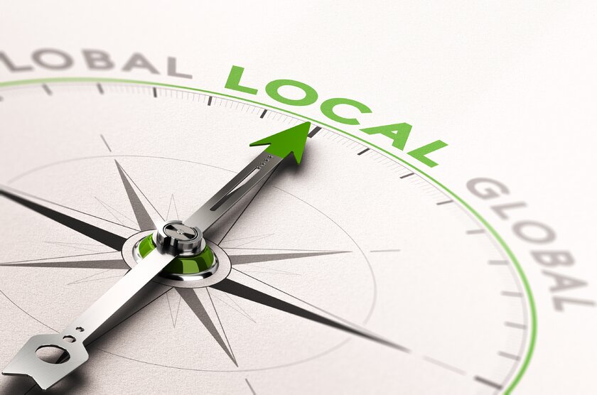 3D illustration of compass with needle pointing to the word local store.