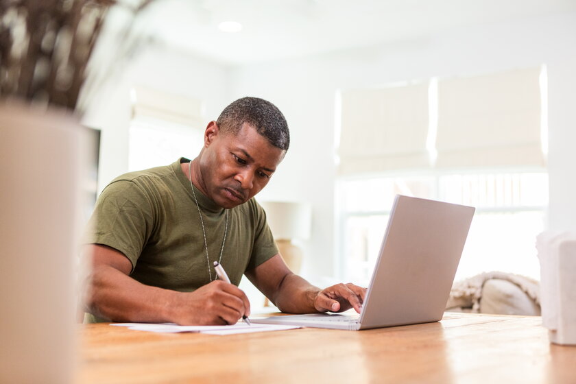 Image of a serious mature soldier who continues training online.